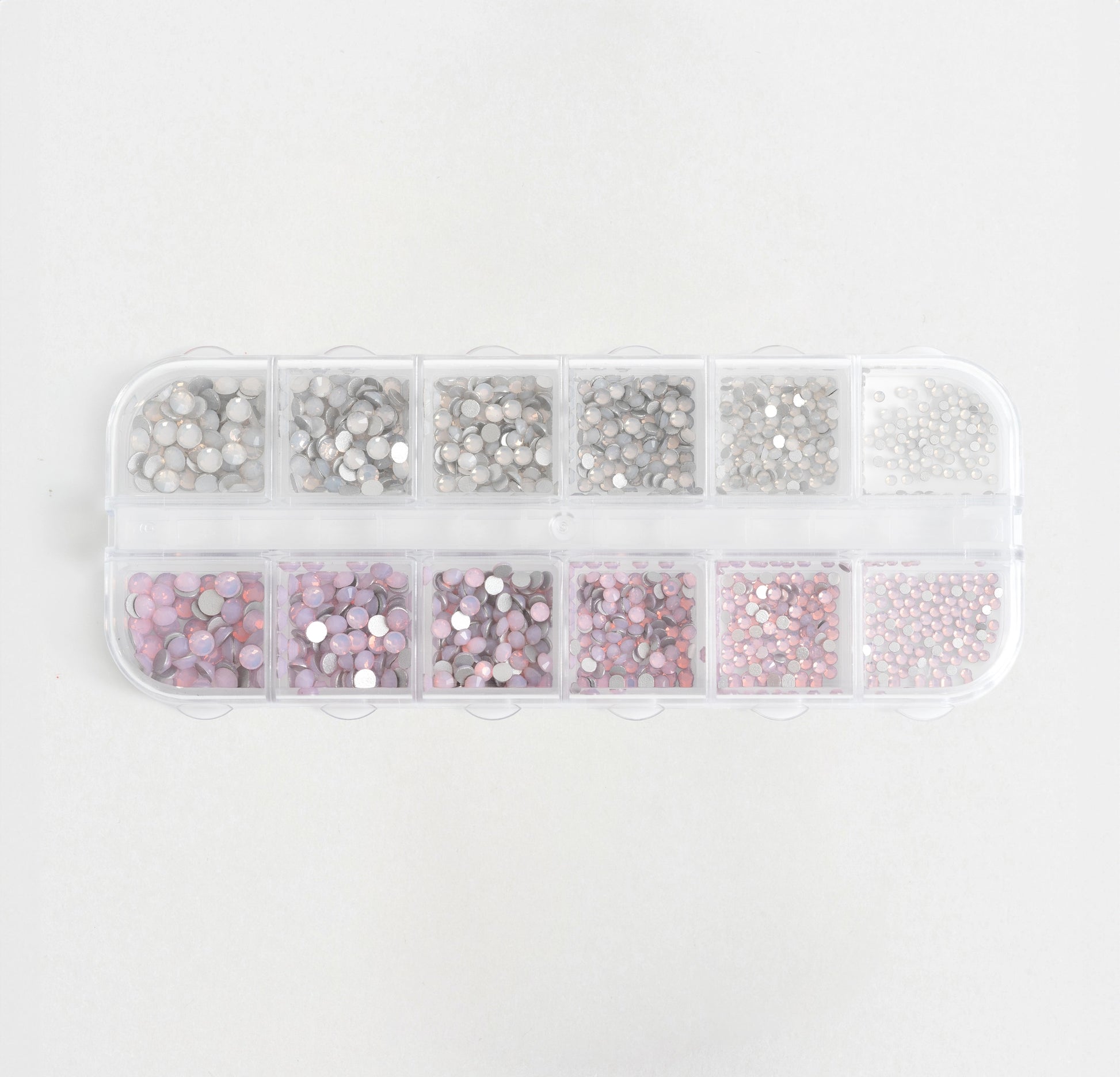 Set organizzato di strass opal rosa e opal bianco per decorazioni unghie.