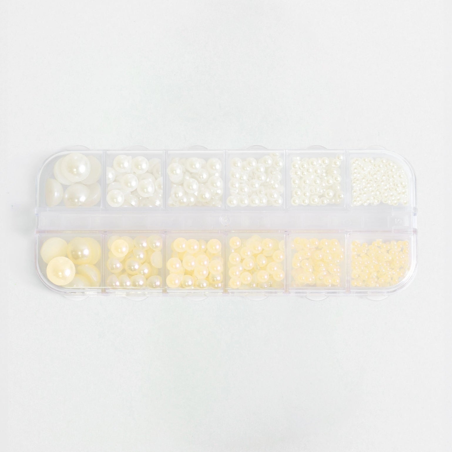 Set completo di perle bianco panna e giallo pastello per decorazioni unghie, in organizer.
